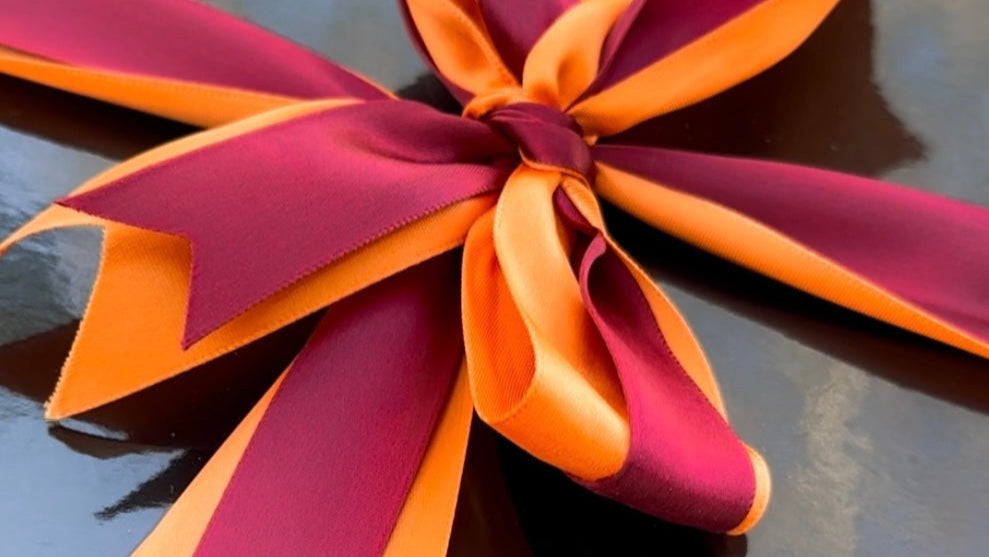 Burg Box luxe box close up with orange and maroon ribbon